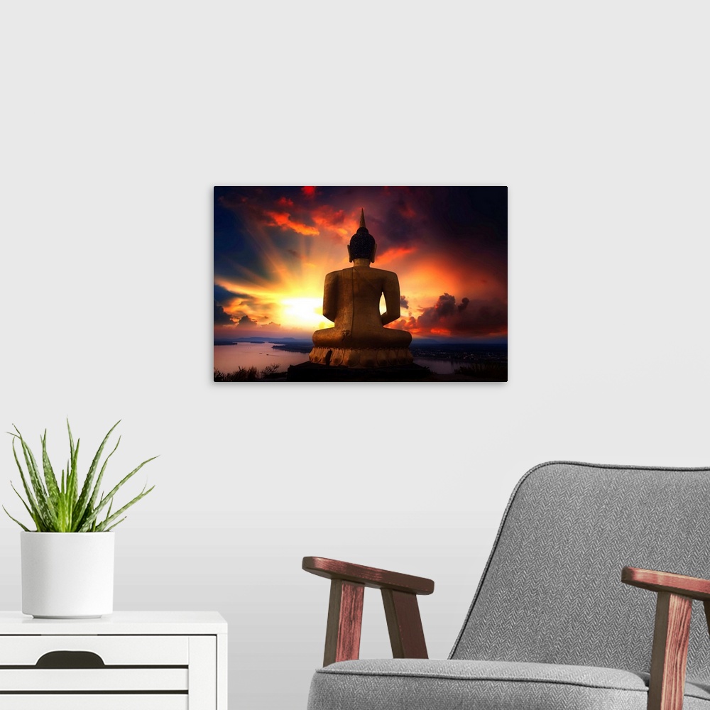 A modern room featuring Buddha facing the sunset