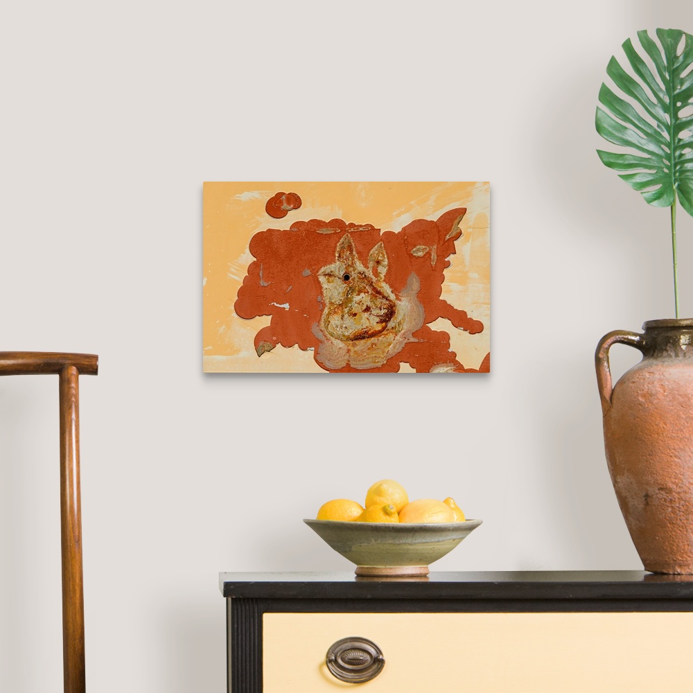 A traditional room featuring A rust-colored spill with the shape of an abstract rabbit.