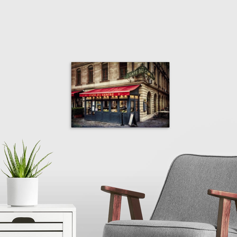 A modern room featuring Red awning over the Cafe du Centre at a street corner in Geneva, Switzerland.
