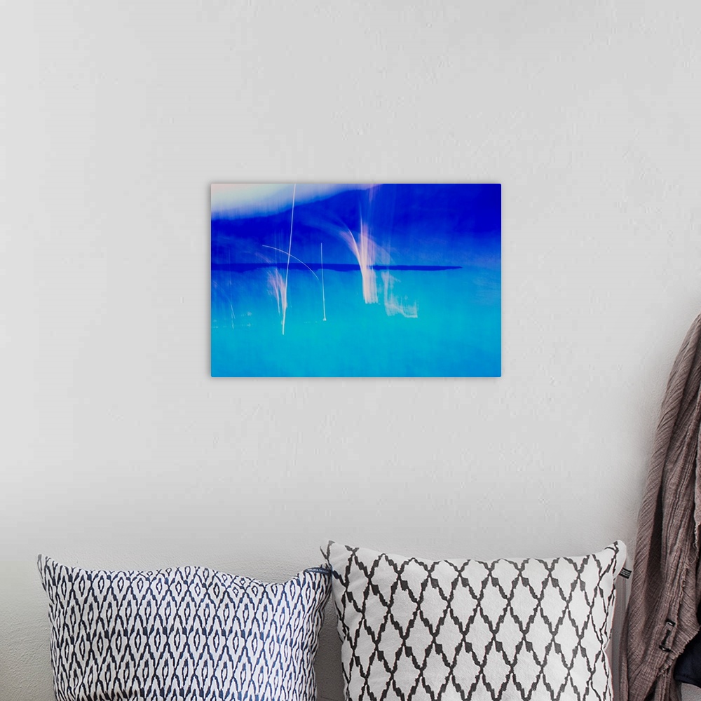 A bohemian room featuring Abstract photograph created with blue and white hues.