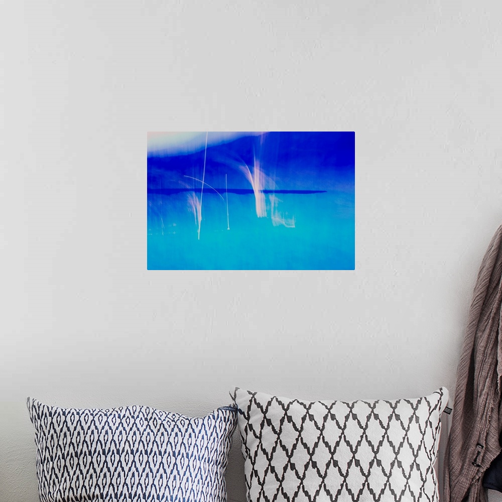 A bohemian room featuring Abstract photograph created with blue and white hues.