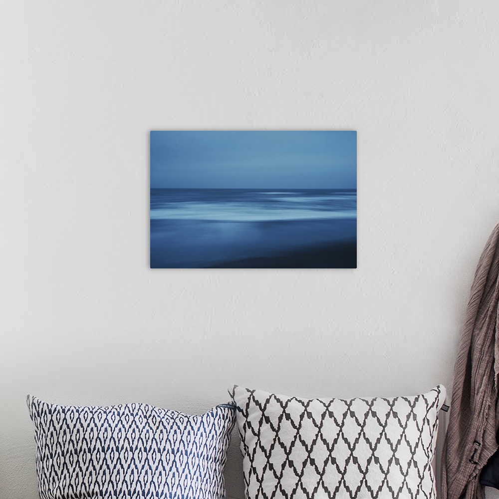 A bohemian room featuring Artistically blurred photo. Evening view of the North Sea, North Jutland, Denmark.