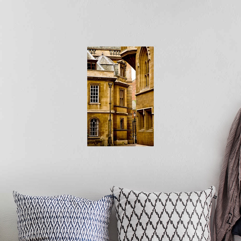 A bohemian room featuring A view of ancient buildings in yellowed stone in Cambridge, England.