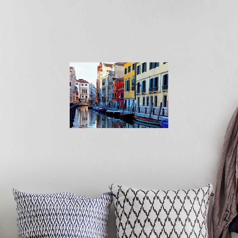 A bohemian room featuring Colorful Houses Along a Canal Santa Croce, Venice Veneto, Italy.