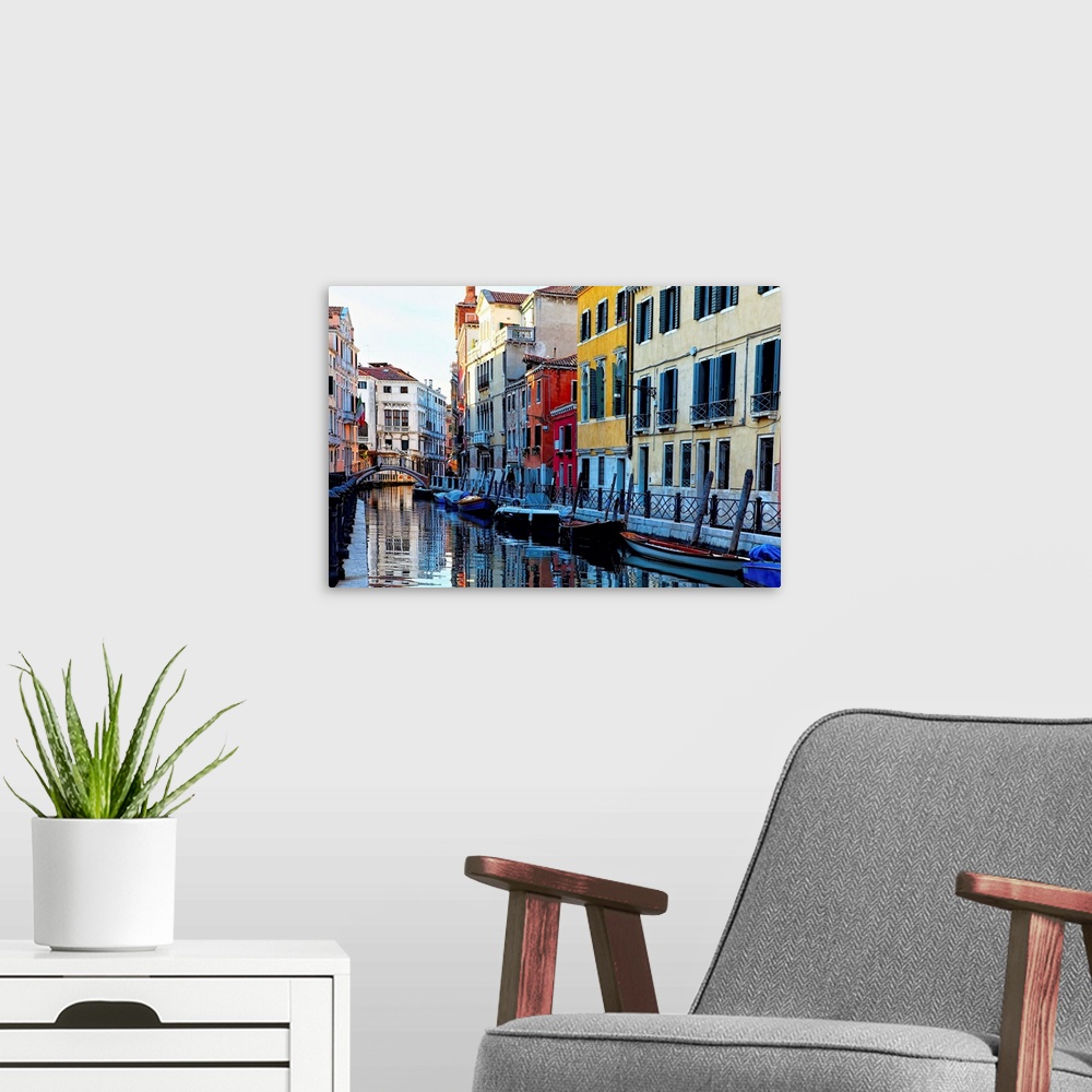 A modern room featuring Colorful Houses Along a Canal Santa Croce, Venice Veneto, Italy.