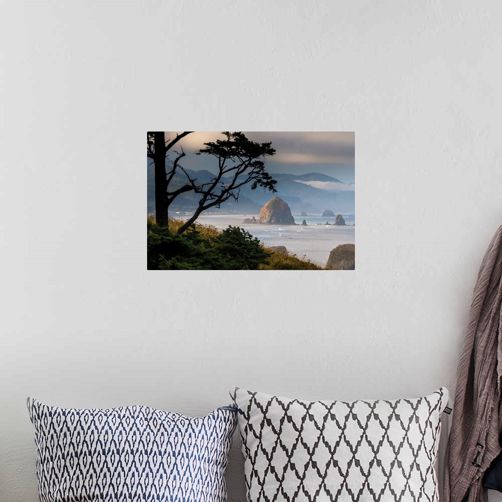 A bohemian room featuring Fine art photo of Haystack Rock on the Oregon coast on a misty morning.