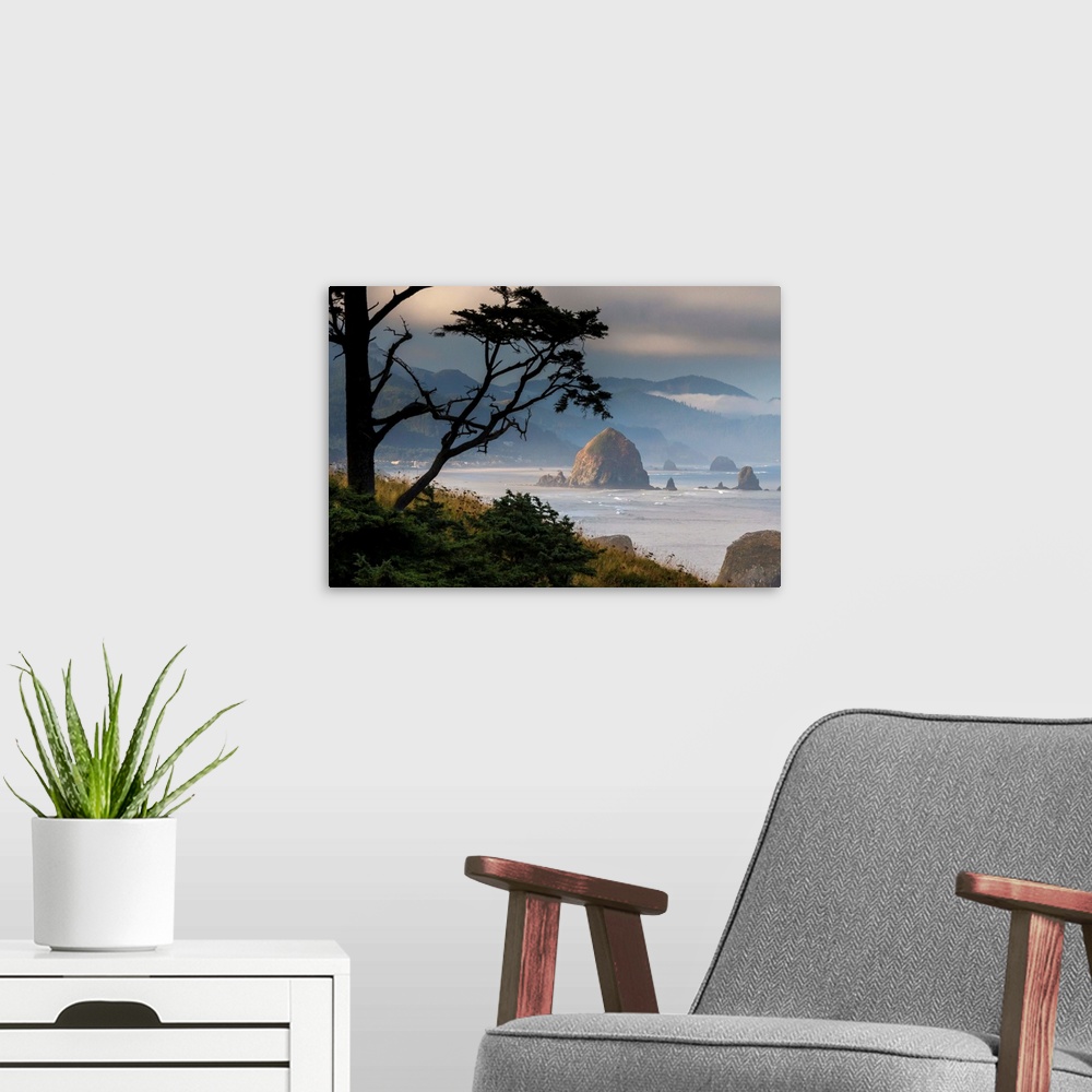 A modern room featuring Fine art photo of Haystack Rock on the Oregon coast on a misty morning.