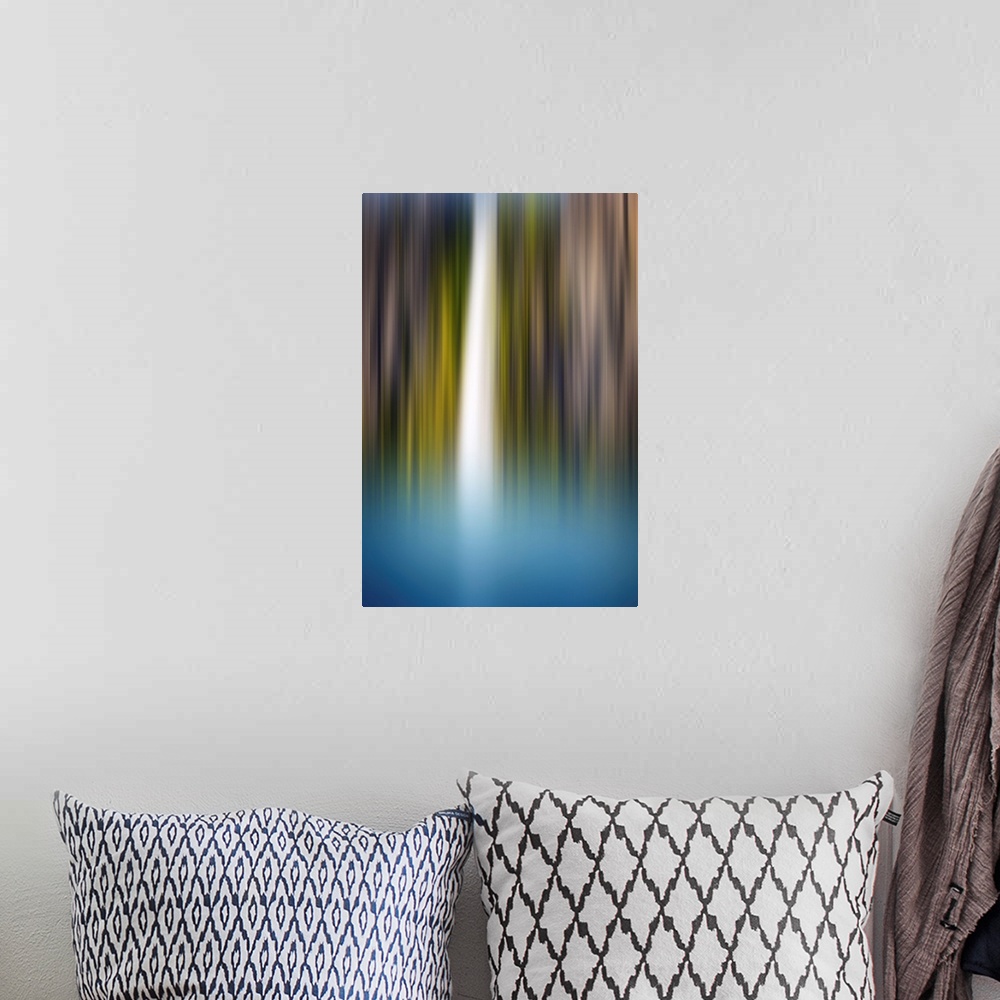 A bohemian room featuring Abstract photograph of a blurred waterfall with brown, green, blue, and white hues.