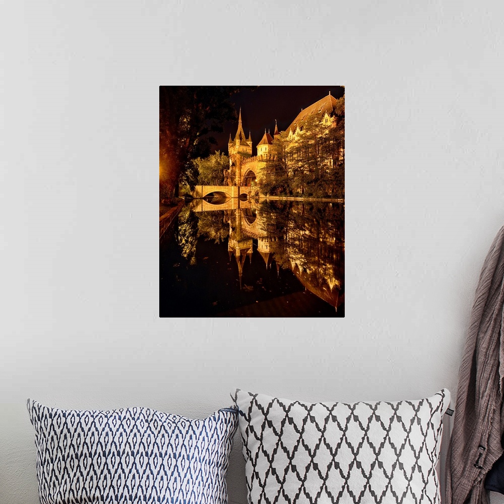 A bohemian room featuring Reflections of a Castle in a Lake at Night, Budapest, Hungary.