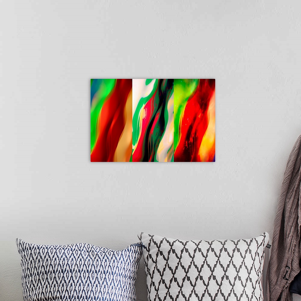A bohemian room featuring Three panel abstract image in shades of red and green.