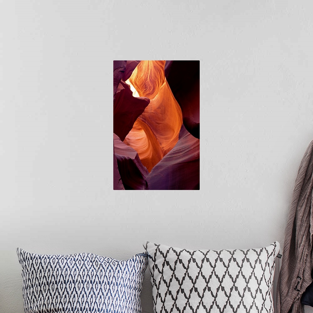 A bohemian room featuring Large photograph taken from within a cave of Antelope Canyon that is located in Arizona.  The wal...