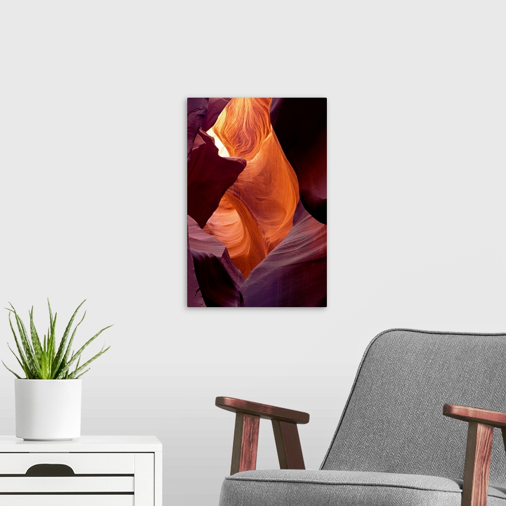 A modern room featuring Large photograph taken from within a cave of Antelope Canyon that is located in Arizona.  The wal...