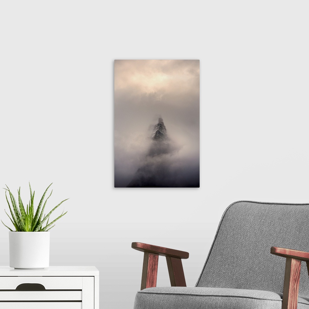 A modern room featuring Mountain top, Aiguille des Dru, in the fog in the valley of Chamonix in French Alpes.