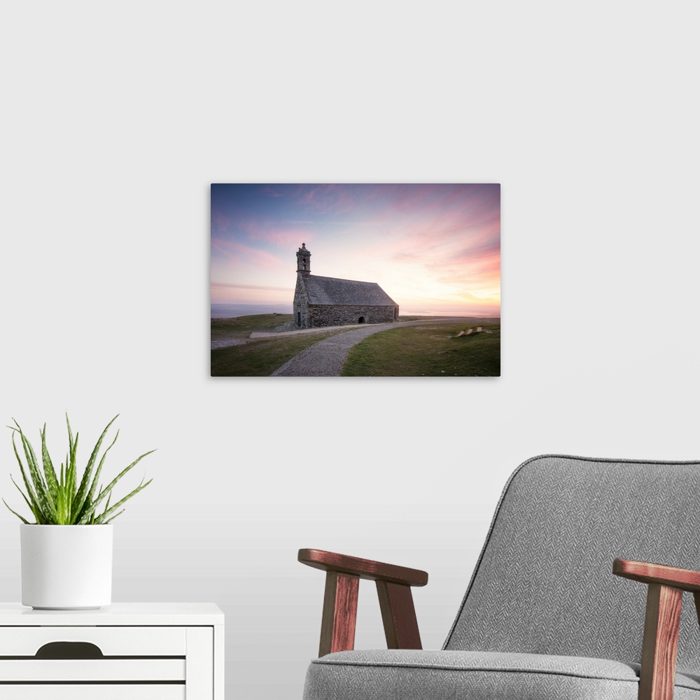 A modern room featuring Photograph of a gravel path leading to Chapelle Saint Michel De Brasparts in France at sunset.