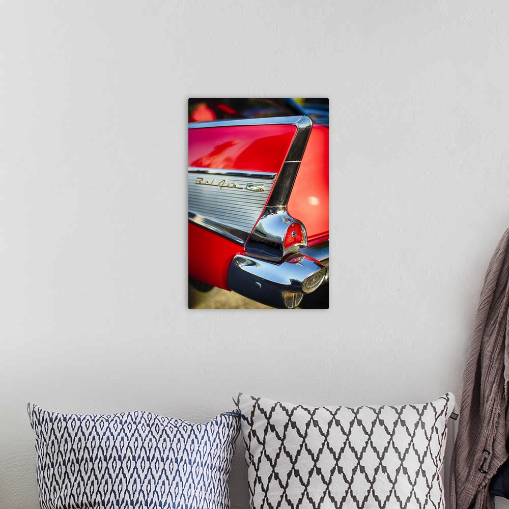 A bohemian room featuring A photograph of a vintage convertible.