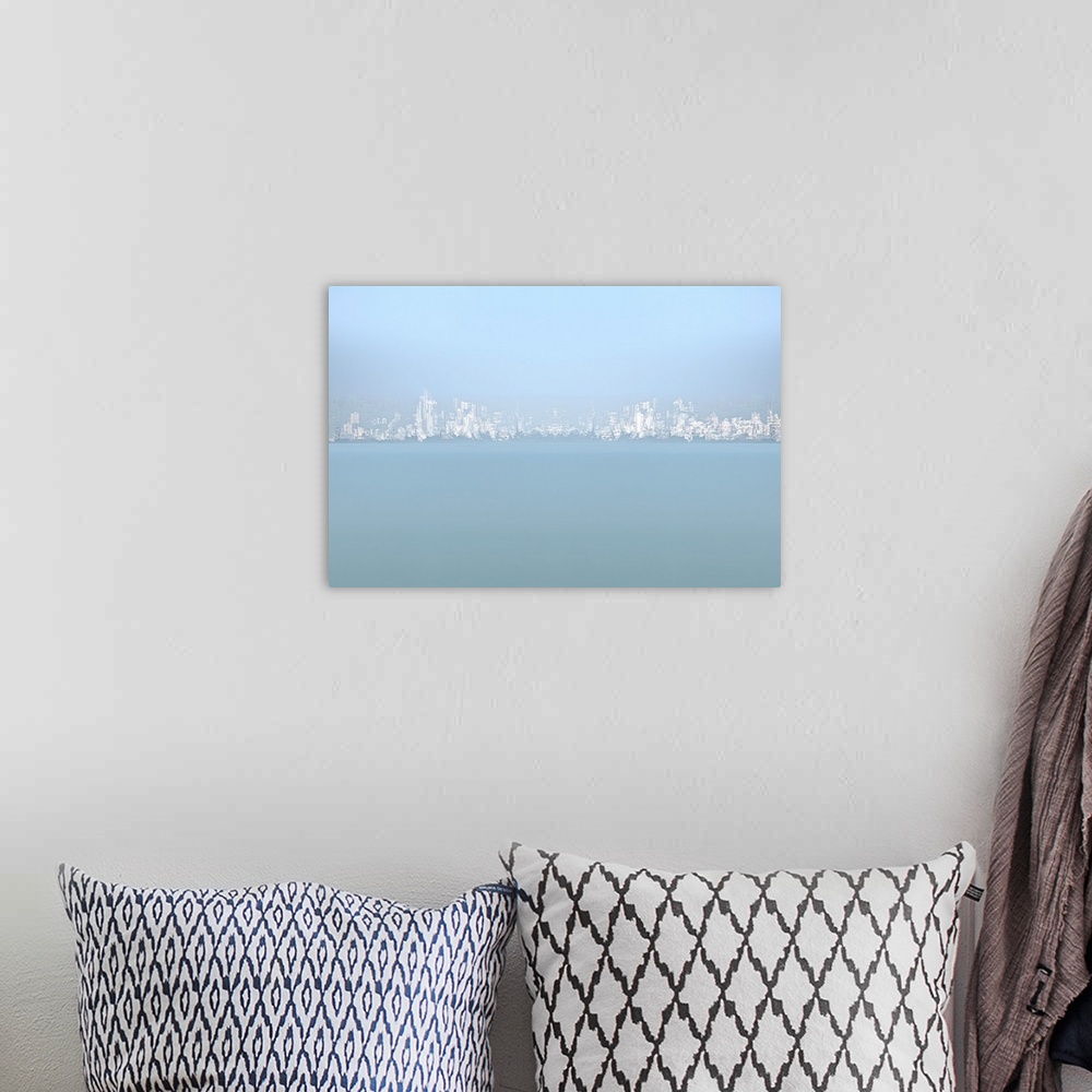 A bohemian room featuring Light blue and white image of an abstract city skyline created with multiple exposures.