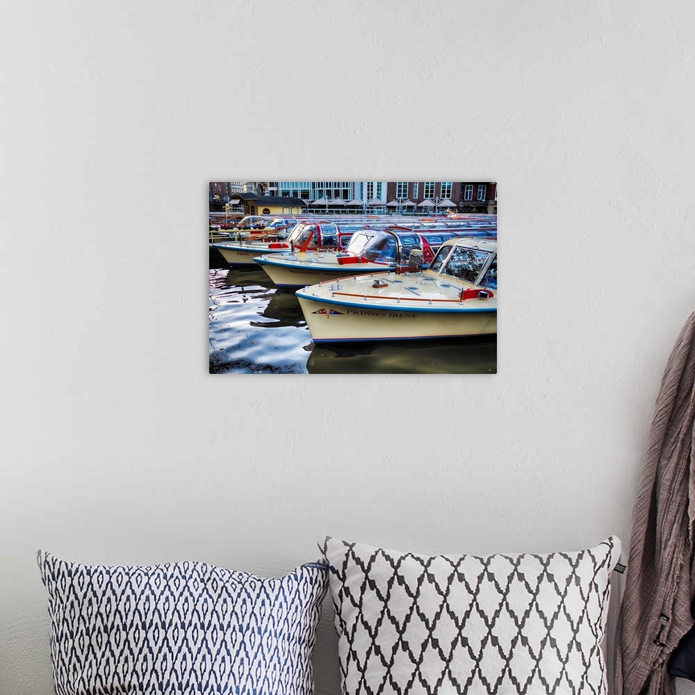 A bohemian room featuring Classic motorboats lined up in a pier, Amsterdam Netherlands.