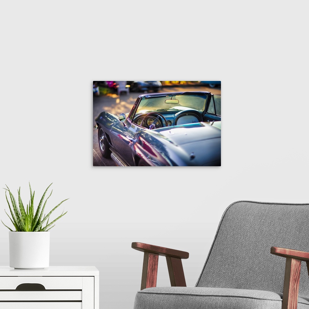 A modern room featuring Driver's Side View of a Classic 1965 Chevrolet Corvette Stingray Roadster Interior with the Instr...