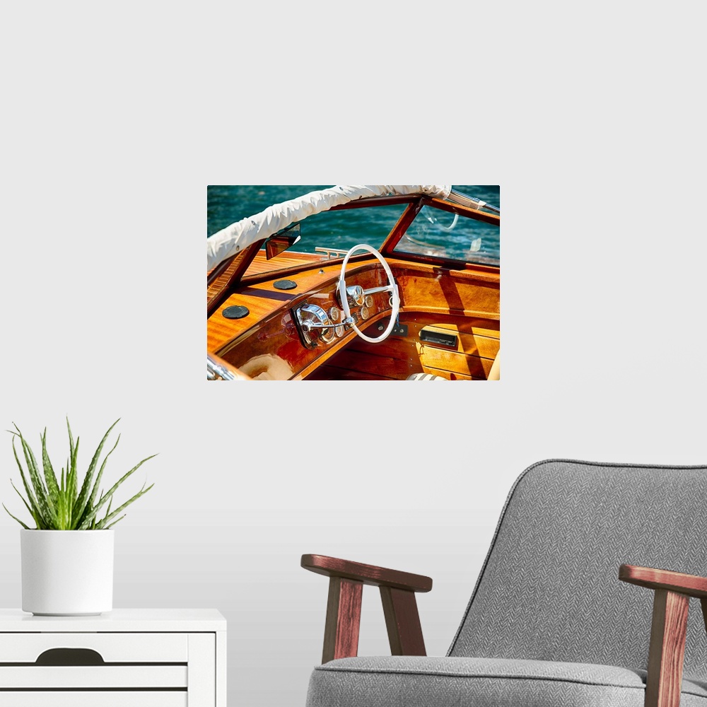 A modern room featuring Fine art photo of the polished wood dashboard of a motorboat.