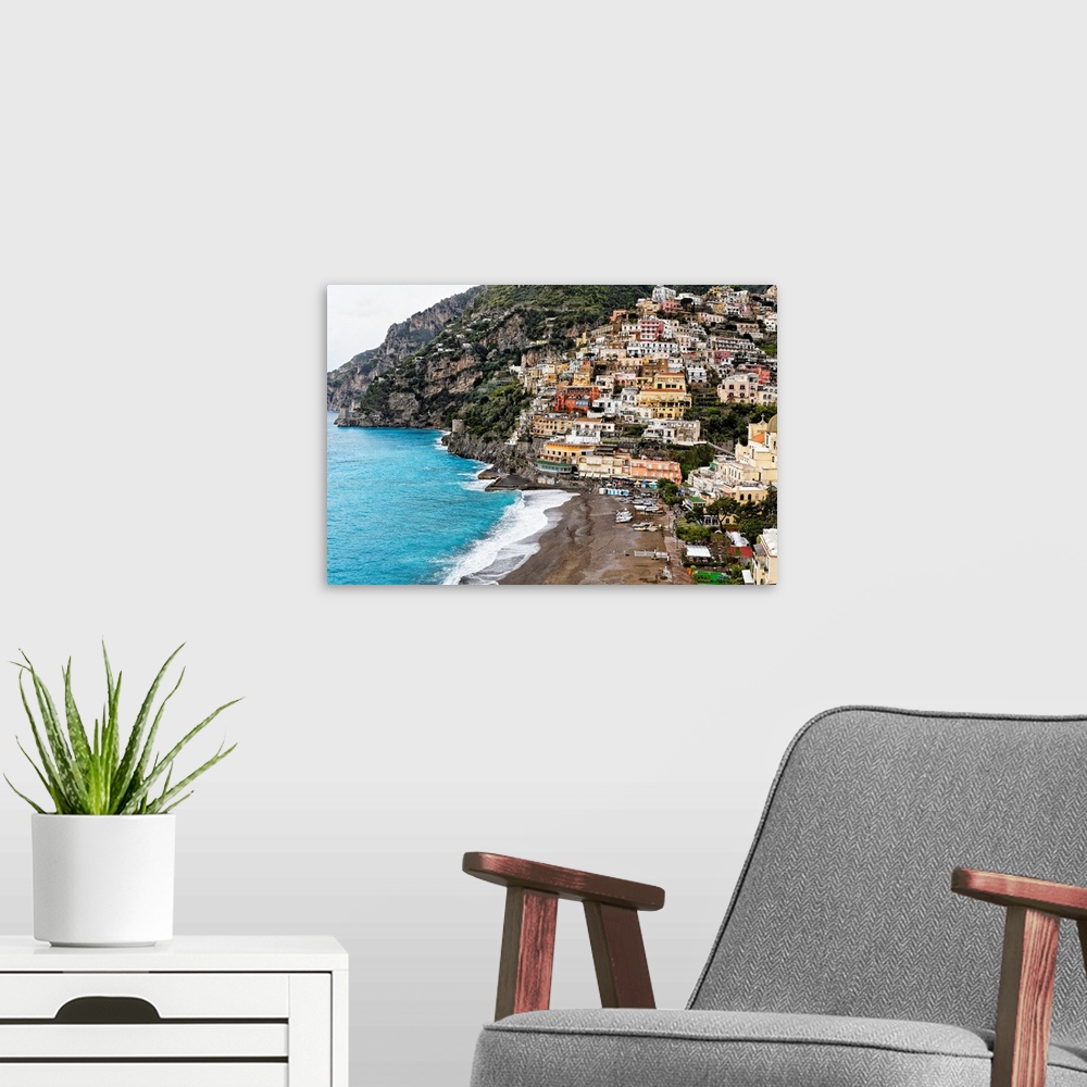 A modern room featuring High angle close up view of the beach and Town of Positano, Campania, Italy.