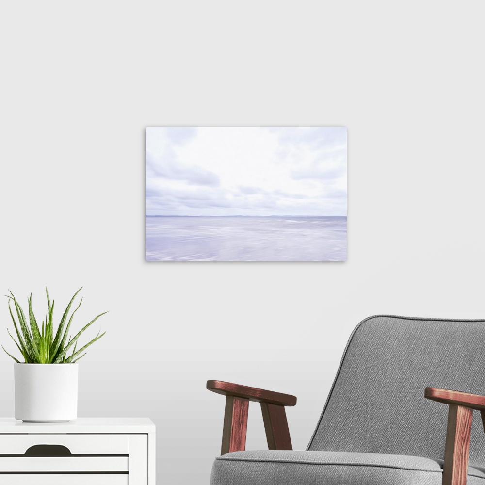 A modern room featuring Artistically blurred photo. A quiet an cloudy autumn day at the coast of The Netherlands.