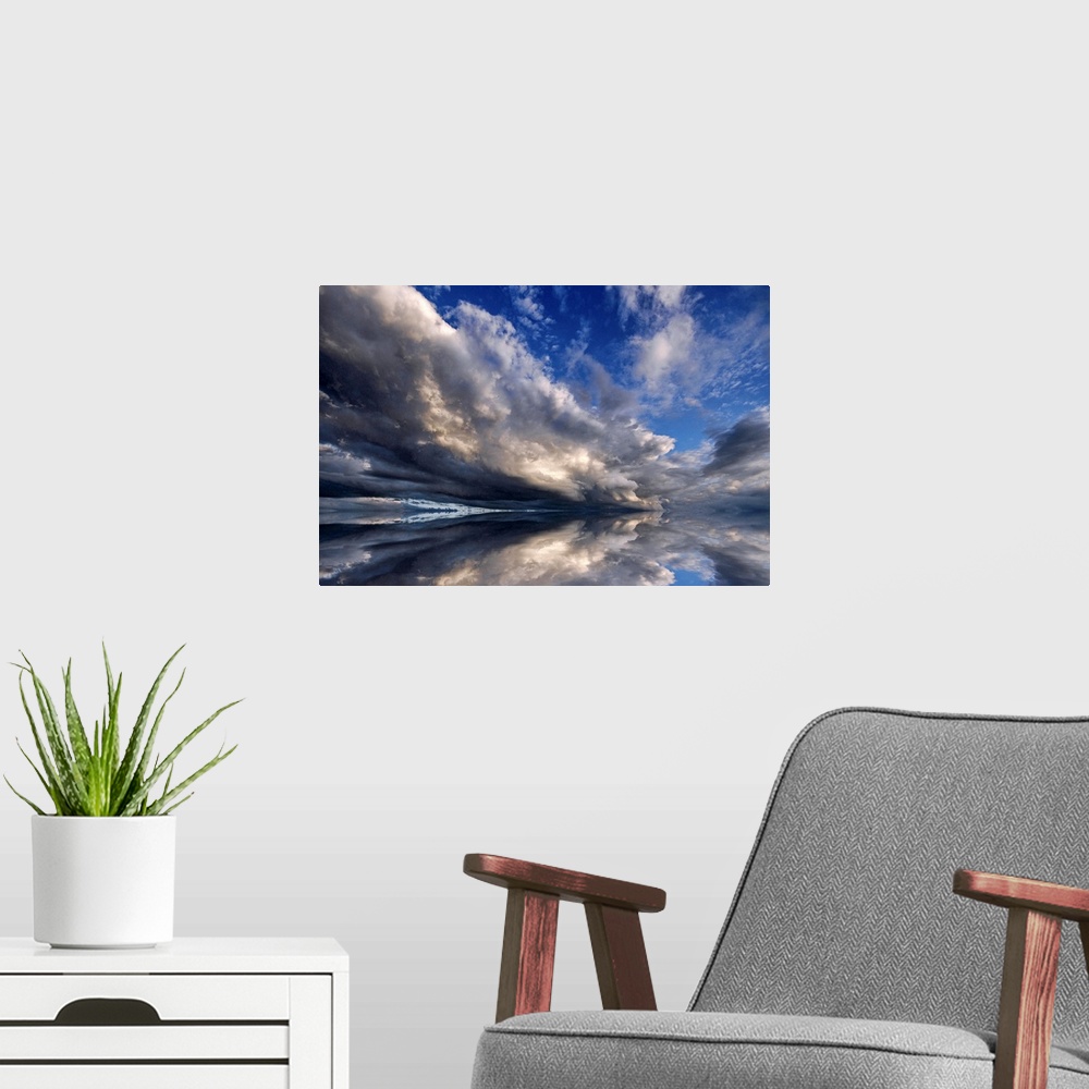 A modern room featuring Photograph of cloudy sky that is reflected in the ocean below.