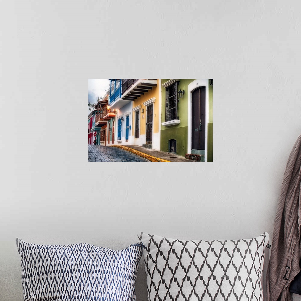A bohemian room featuring Fine art photo of a cobblestone road with colorful buildings in San Juan, Puerto Rico.