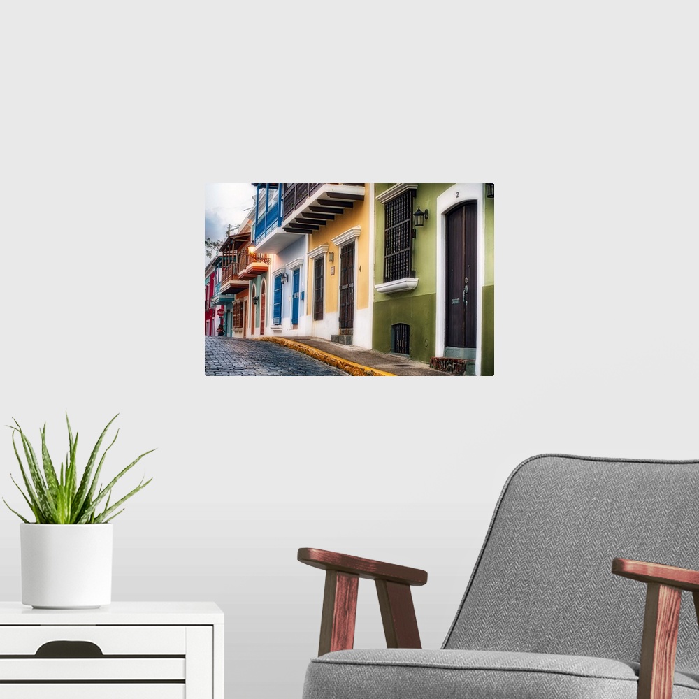 A modern room featuring Fine art photo of a cobblestone road with colorful buildings in San Juan, Puerto Rico.