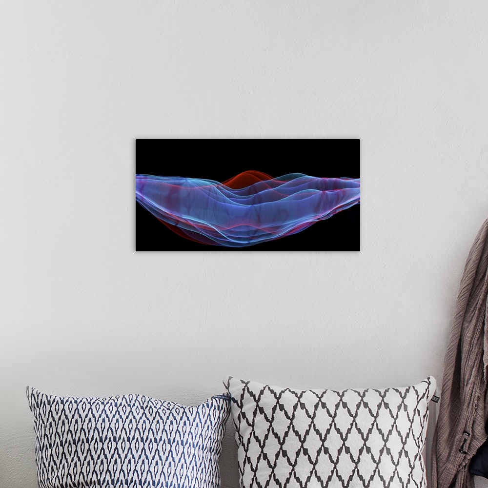 A bohemian room featuring A macro photograph of an abstract shape in multiple colors against a black background.