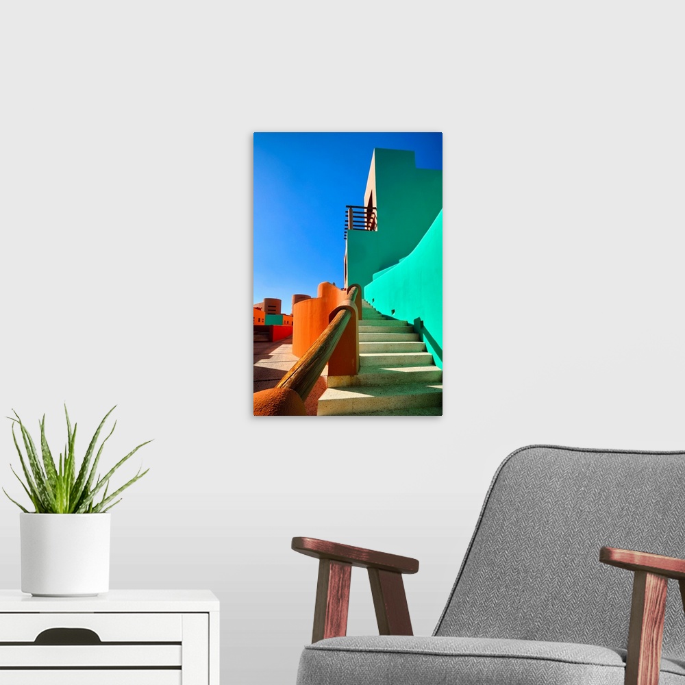 A modern room featuring Low angle view of bold colored Mexican style architecture, Cabo San Lucas, Baja California Sur, M...