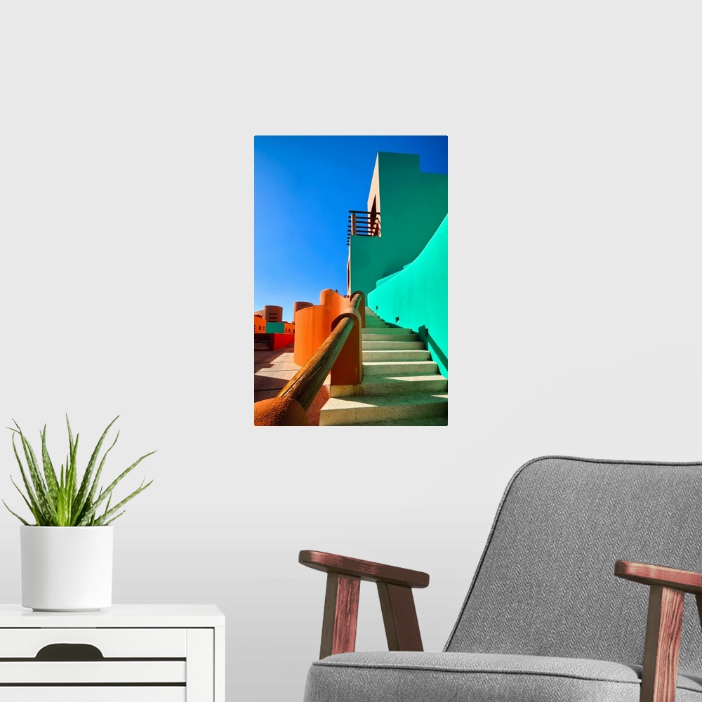 A modern room featuring Low angle view of bold colored Mexican style architecture, Cabo San Lucas, Baja California Sur, M...