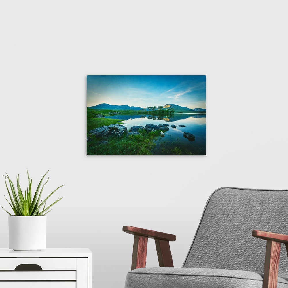 A modern room featuring Ireland landscape with lake and mountain