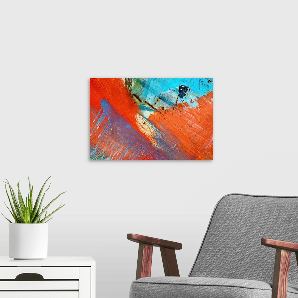 A modern room featuring Close up of graffiti on a wall, creating an abstract image in turquoise and orange.