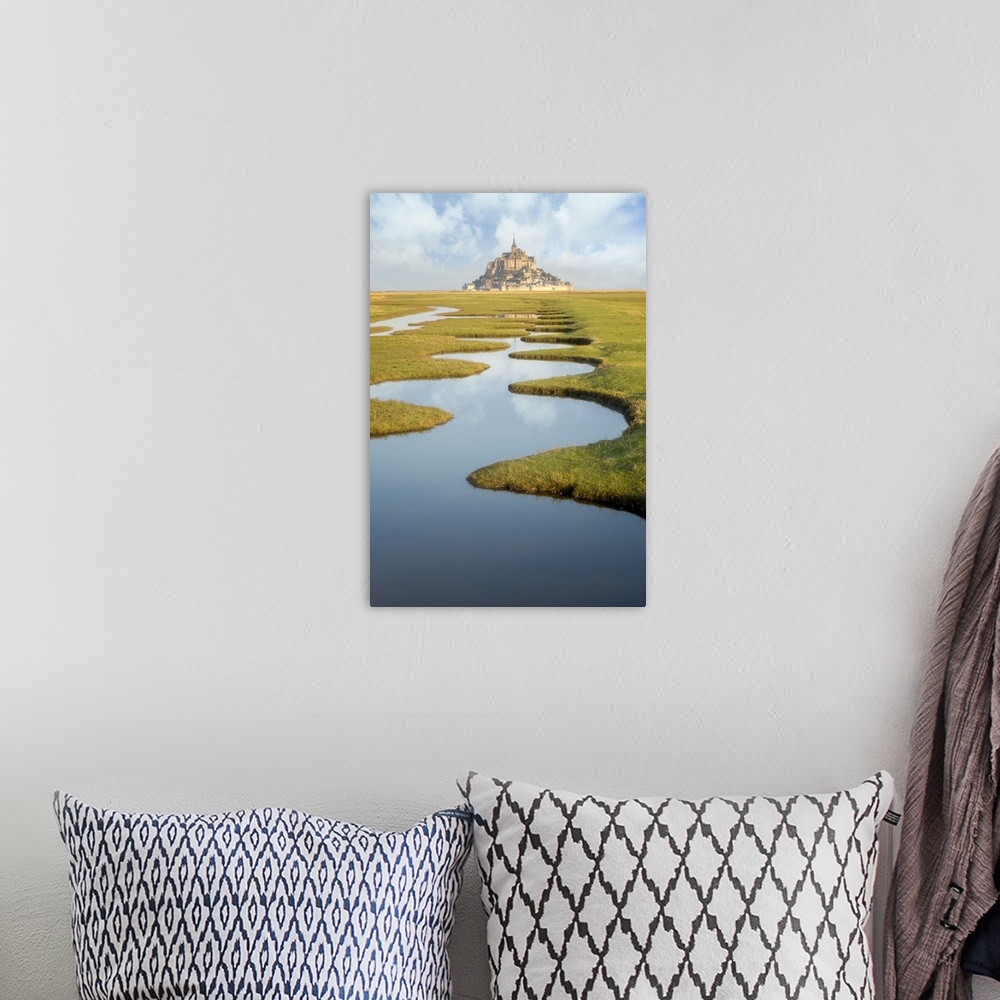 A bohemian room featuring Around Mont Saint Michel in France. After high tides, some nices water draws on the green lands c...
