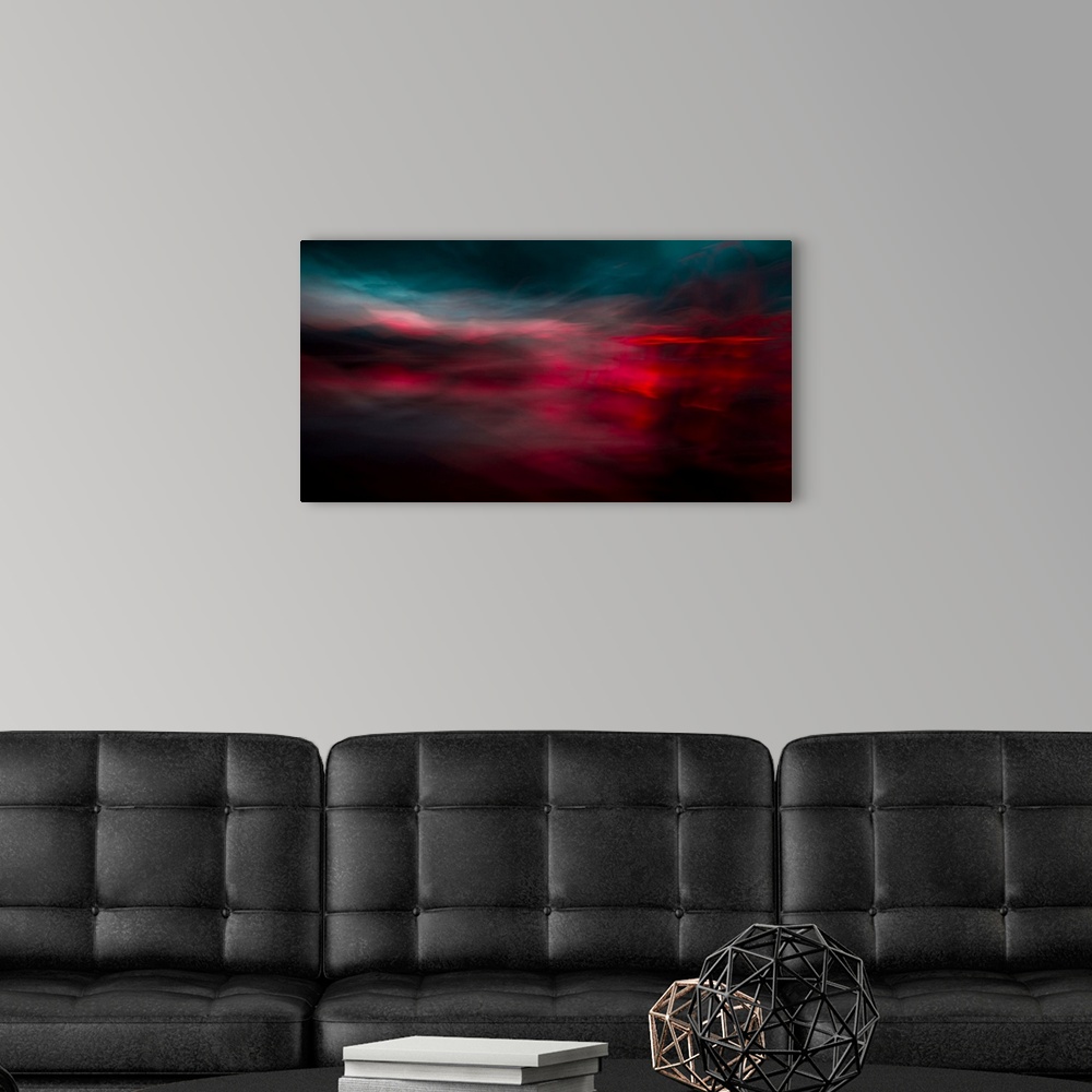 A modern room featuring An impressionistic dreamy blurred Turneresque seascape of swirling water and sky in dramatic deep...