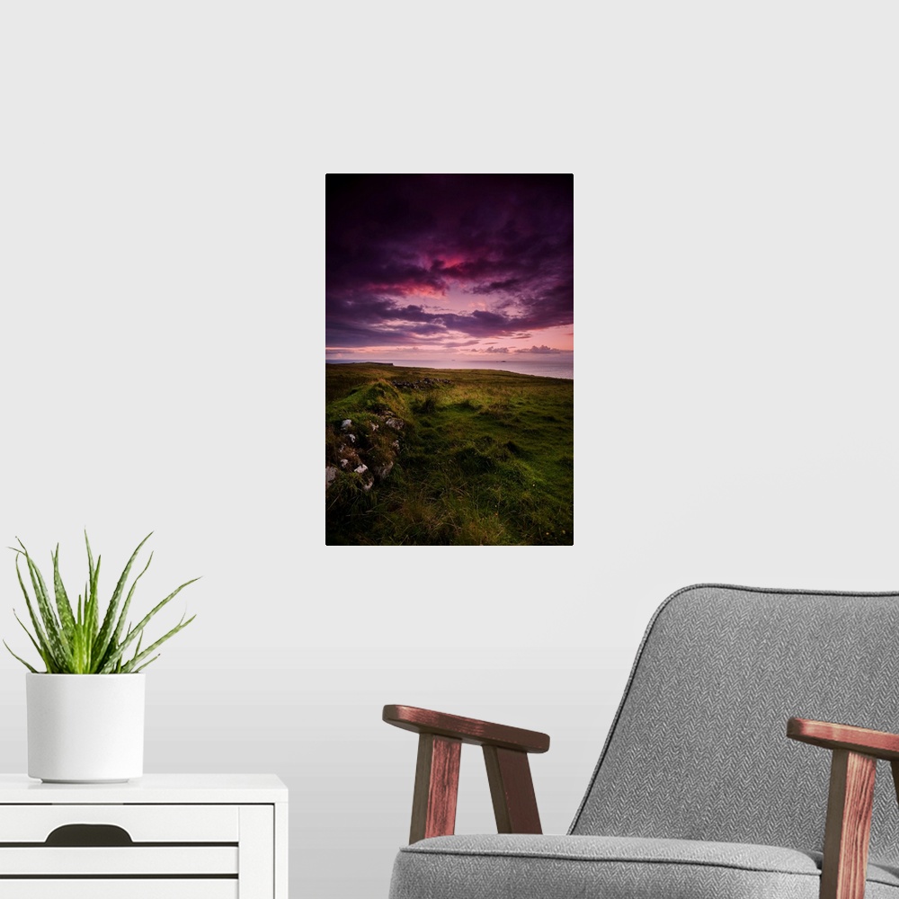 A modern room featuring Fine art photo of a dramatic purple sky at sunset over a grassy meadow.