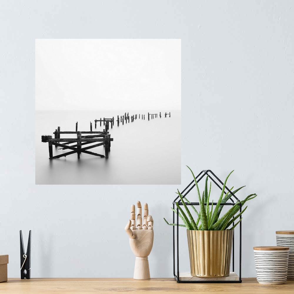 A bohemian room featuring Large photograph focuses on a deteriorating dock sitting alone in a wasteland of fog.
