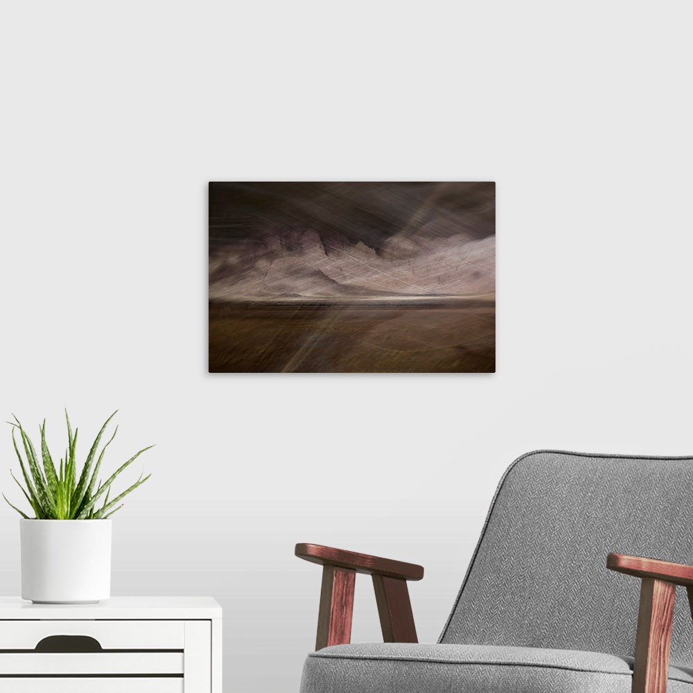 A modern room featuring Abstract image of a desert storm with thin lines on top creating movement and a rocky textured ba...