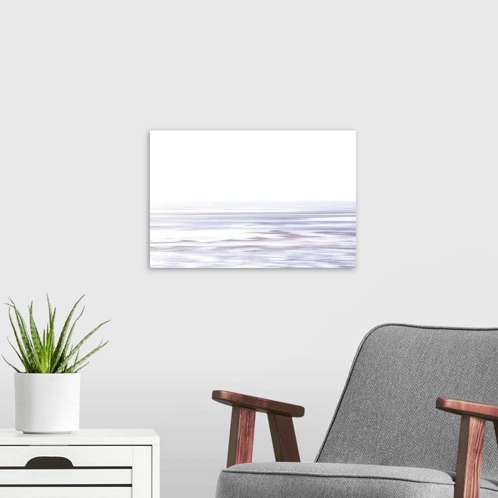 A modern room featuring Artistically blurred photo. A sunny afternoon on a winter day at the coast of the sea Kattegat in...