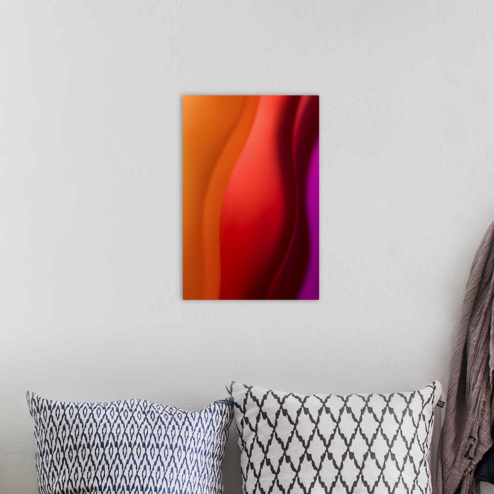 A bohemian room featuring Abstract photograph in purple and red vertical layers.
