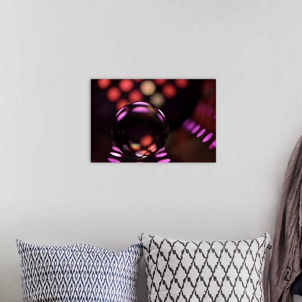 A bohemian room featuring Abstract photo of a glass ball reflecting colored dots.