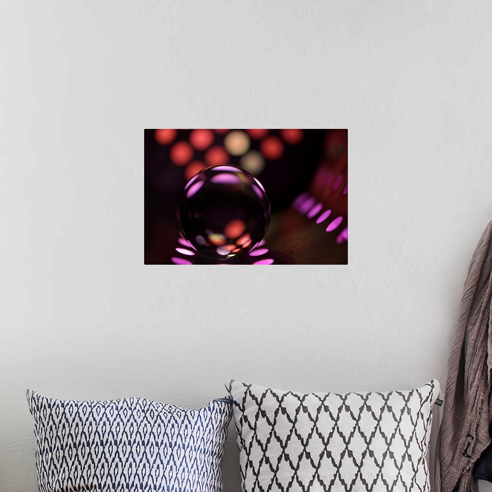 A bohemian room featuring Abstract photo of a glass ball reflecting colored dots.