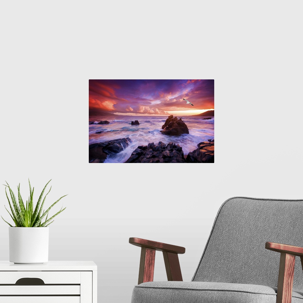 A modern room featuring A photograph of a rocky sunset coastal landscape.