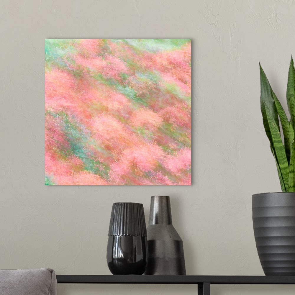 A modern room featuring Dreamy photograph of pink flowers in a field with blurred movement and a pastel colored background.