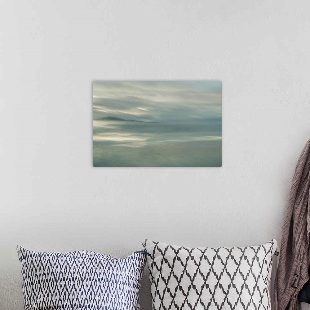 A bohemian room featuring Abstract fine art photograph of a dreamy ocean and a darker silhouetted island in the distance.