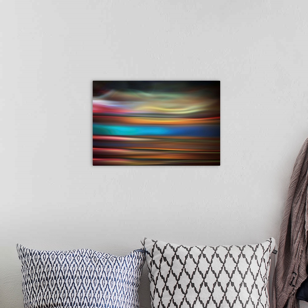 A bohemian room featuring Abstract photo of smooth waves in varying tones of purple and blue.
