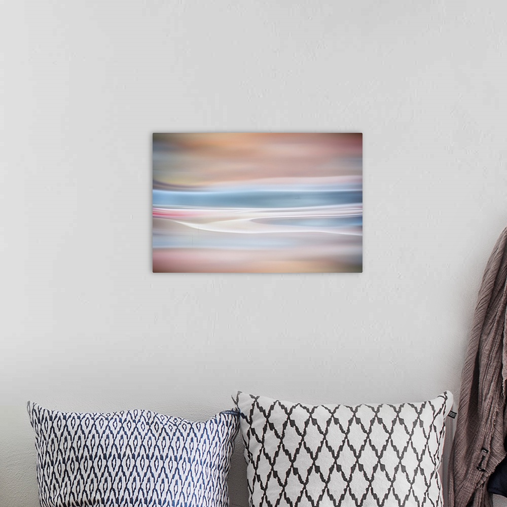 A bohemian room featuring Abstract artwork of warm and cool colors to create an ethereal mood.
