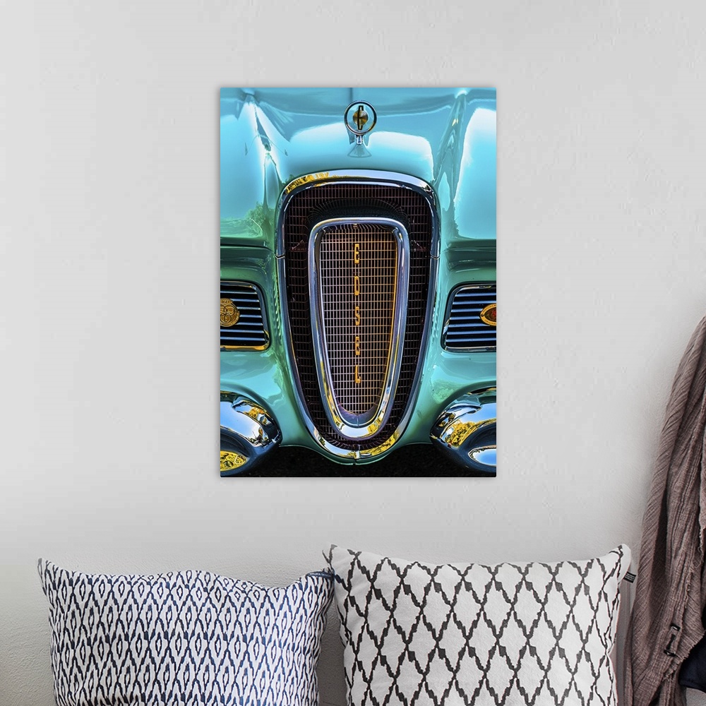 A bohemian room featuring The front grille of a bright turquoise vintage car.