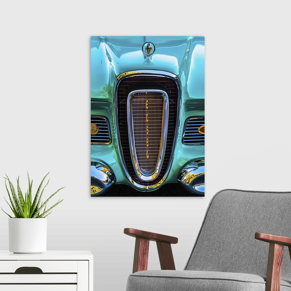 A modern room featuring The front grille of a bright turquoise vintage car.
