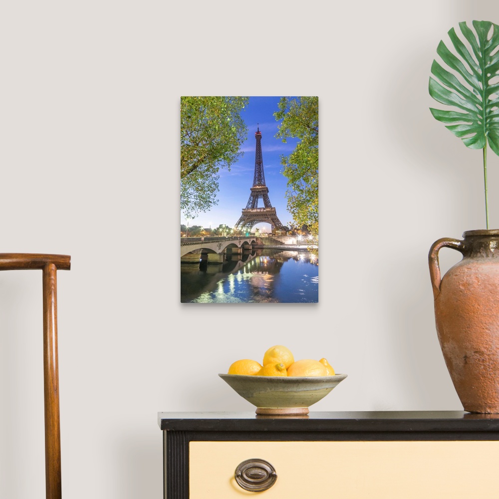 A traditional room featuring Early morning for the Eiffel tower in Paris, facing the Jena bridge with green trees around and l...
